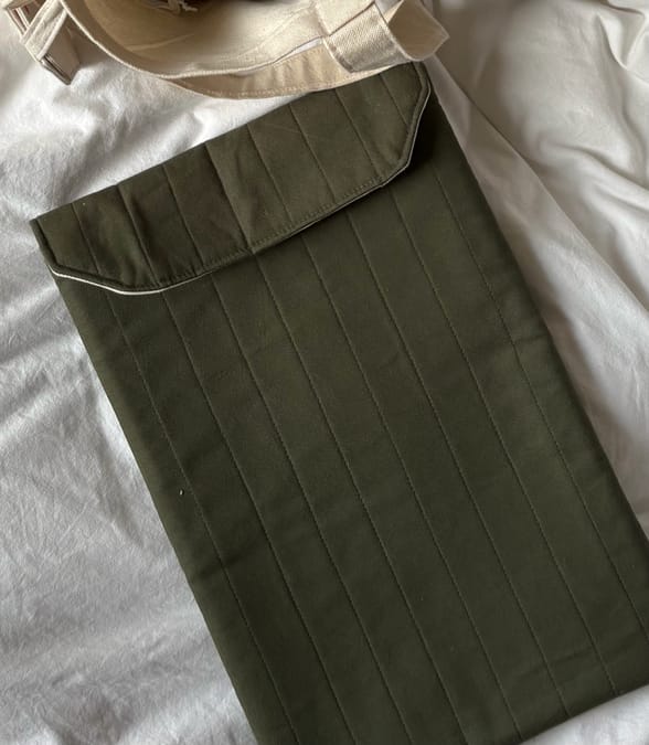 Handmade quilted forest green laptop sleeve with magnetic closure