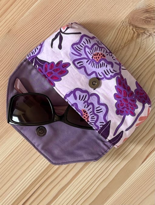 Handmade sunglasses case open showing sunglasses inside